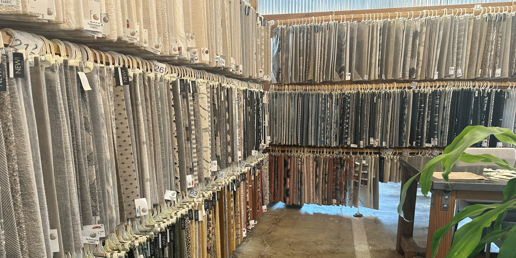 Huge fabric swatch wall at BY DESIGN
